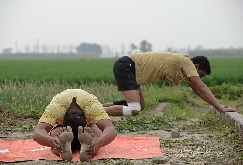 Limbering up for a kabbadi game. Limbering up for a kabbadi game.