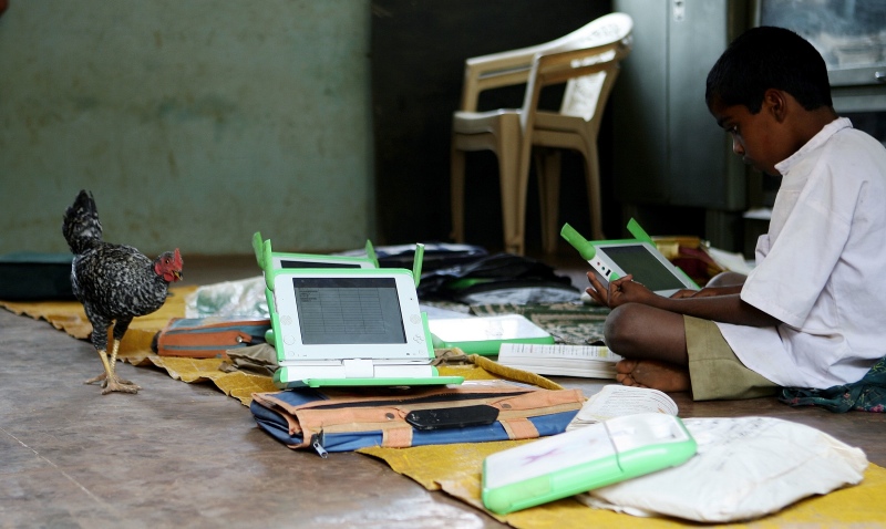A child in a Maharashtra school works on his laptop provided as part of the One Laptop Per Child non-profit organisation's India pilot study in 2008. (Pal Pillai/AFP). A child in a Maharashtra school works on his laptop provided as part of the One Laptop Per Child non-profit organisation's India pilot study in 2008. (Pal Pillai/AFP).