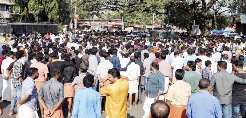 BJP workers outside the building in Kannur, Kerala, where the body of a slain party worker was kept. (Photo credit: TA Ameerudheen). BJP workers outside the building in Kannur, Kerala, where the body of a slain party worker was kept. (Photo credit: TA Ameerudheen).