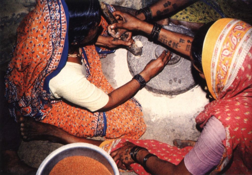 Grindmill with two women. Grindmill with two women.