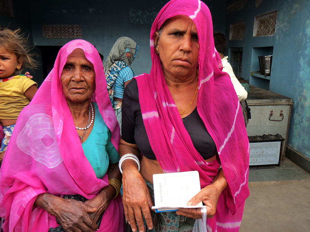 Geeta Devi (right) says she had to try to enrol in Aadhaar thrice, after her husband's name was misspelled two times. Dapu Devi (left) says she has not been able to access her pensions since it was shifted from the post-office to a bank four months back after she enrolled in Aadhaar. Geeta Devi (right) says she had to try to enrol in Aadhaar thrice, after her husband's name was misspelled two times. Dapu Devi (left) says she has not been able to access her pensions since it was shifted from the post-office to a bank four months back after she enrolled in Aadhaar.