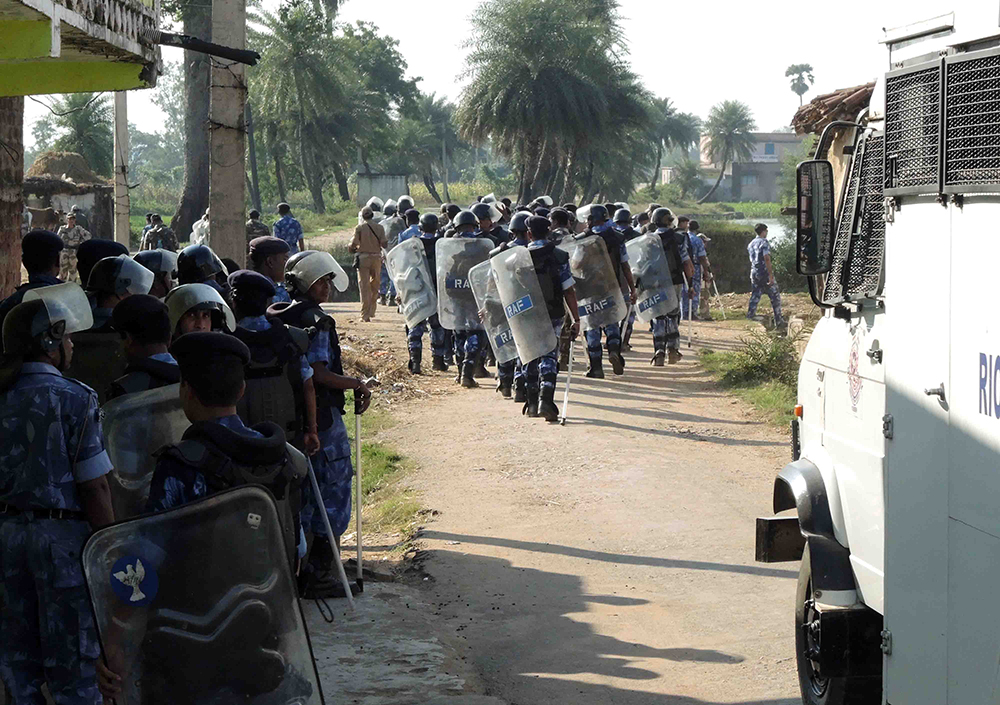 Security personnel in the villages near coal mine site on Monday. Credit: Manob Chowdhury Security personnel in the villages near coal mine site on Monday. Credit: Manob Chowdhury