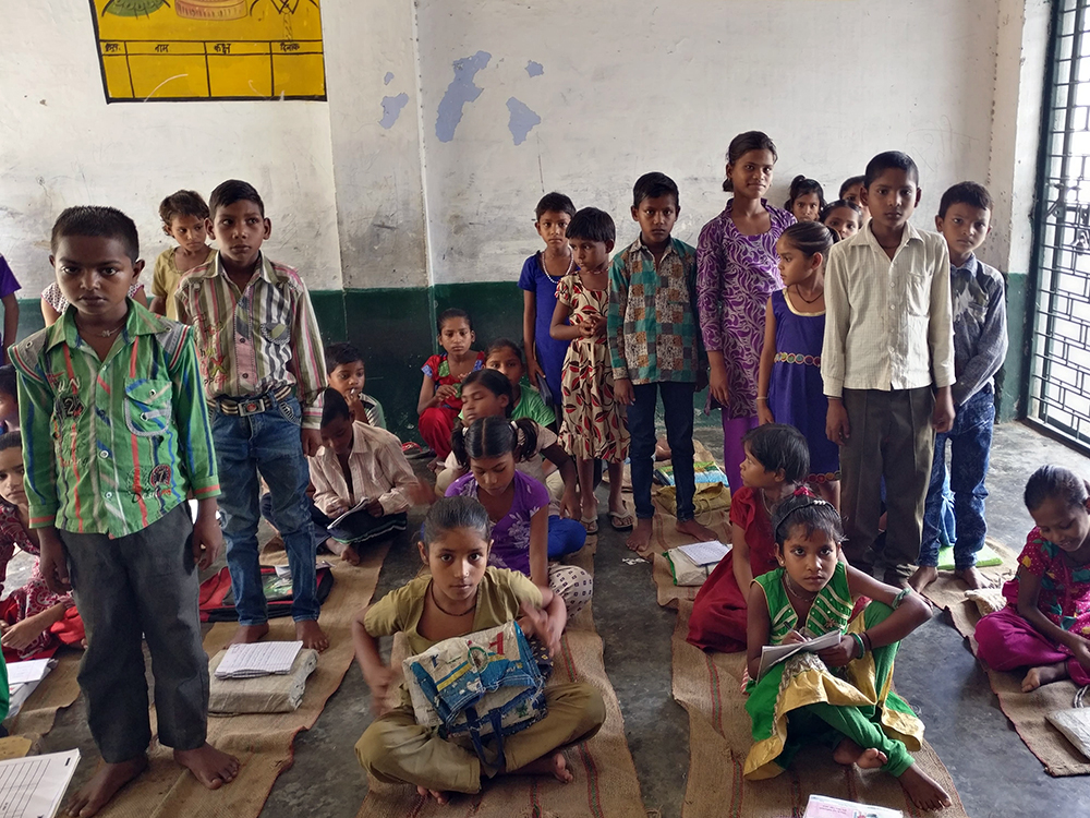 Students of classes 4 and 5 without Aadhaar at the primary school in Burra stand up. Photo credit: Shreya Roy Chowdhury Students of classes 4 and 5 without Aadhaar at the primary school in Burra stand up. Photo credit: Shreya Roy Chowdhury