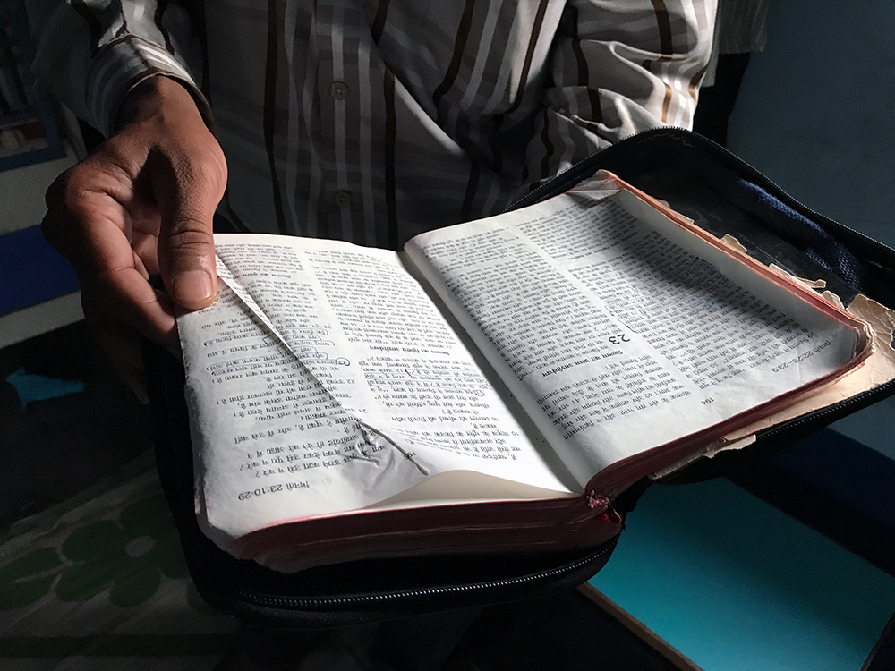 Pastor Hatesingh Gundiya shows his well-read Hindi Bible. Photo: Mridula Chari Pastor Hatesingh Gundiya shows his well-read Hindi Bible. Photo: Mridula Chari