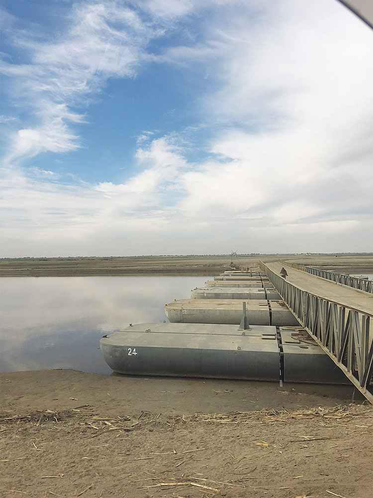 A pontoon, sponsored by the UAE , helps locals travel across the Indus river between Rahim Yar Khan and Rojhan. Photo credit: Subuk Hasnain A pontoon, sponsored by the UAE , helps locals travel across the Indus river between Rahim Yar Khan and Rojhan. Photo credit: Subuk Hasnain
