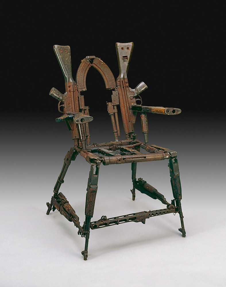 Throne of weapons made from melted down weapons used in Mozambique's civil war, by Cristóvão Canhavato (Kester), 2001 CE. Photo: The British Museum Throne of weapons made from melted down weapons used in Mozambique's civil war, by Cristóvão Canhavato (Kester), 2001 CE. Photo: The British Museum