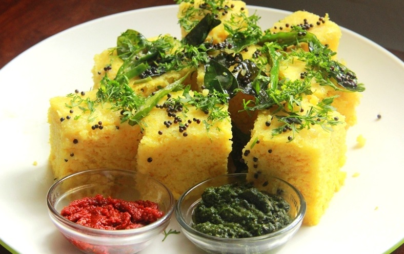 Dhokla, the vegetarian delicacy that originates from Gujarat is made with the fermented batter derived from rice and split chickpea. Photo credit: Dhananjai/Wikimedia Commons CC-BY-SA-4.0 Dhokla, the vegetarian delicacy that originates from Gujarat is made with the fermented batter derived from rice and split chickpea. Photo credit: Dhananjai/Wikimedia Commons CC-BY-SA-4.0