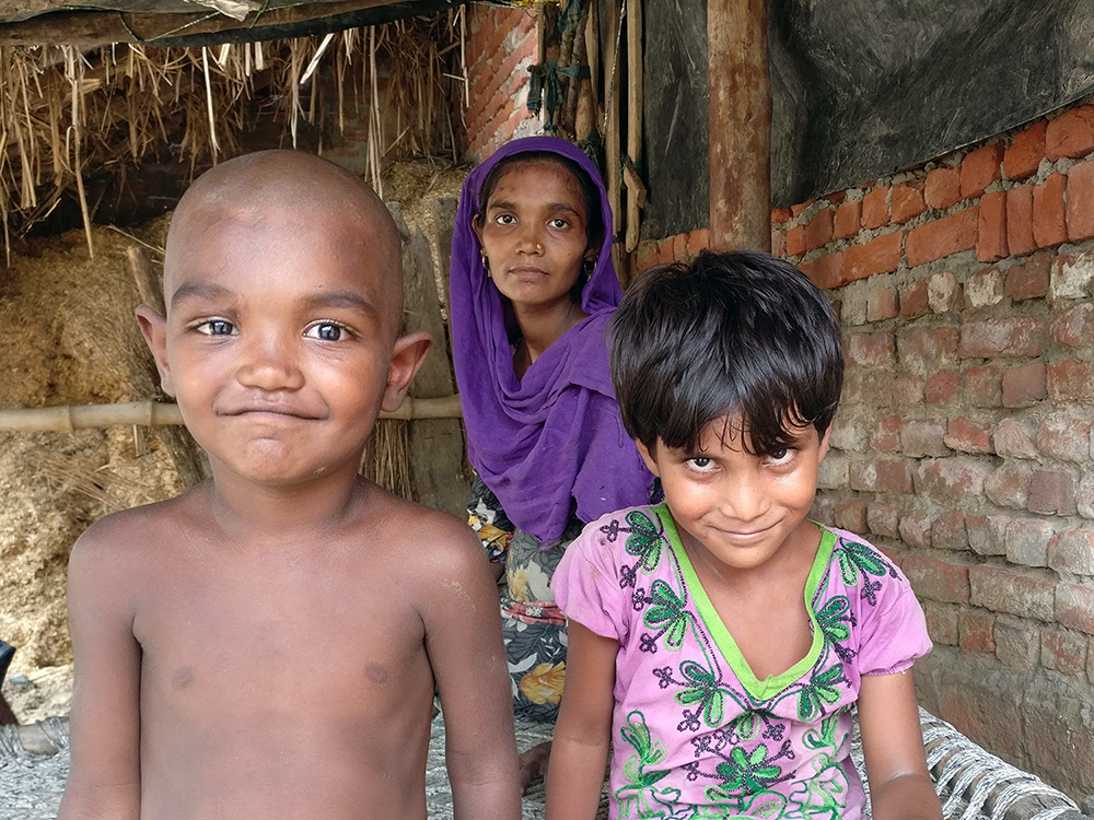 Iram with her cousin Mohammad Zeeshan and his mother Farzana. Both children are yet to be enrolled. Photo credit: Shreya Roy Chowdhury Iram with her cousin Mohammad Zeeshan and his mother Farzana. Both children are yet to be enrolled. Photo credit: Shreya Roy Chowdhury