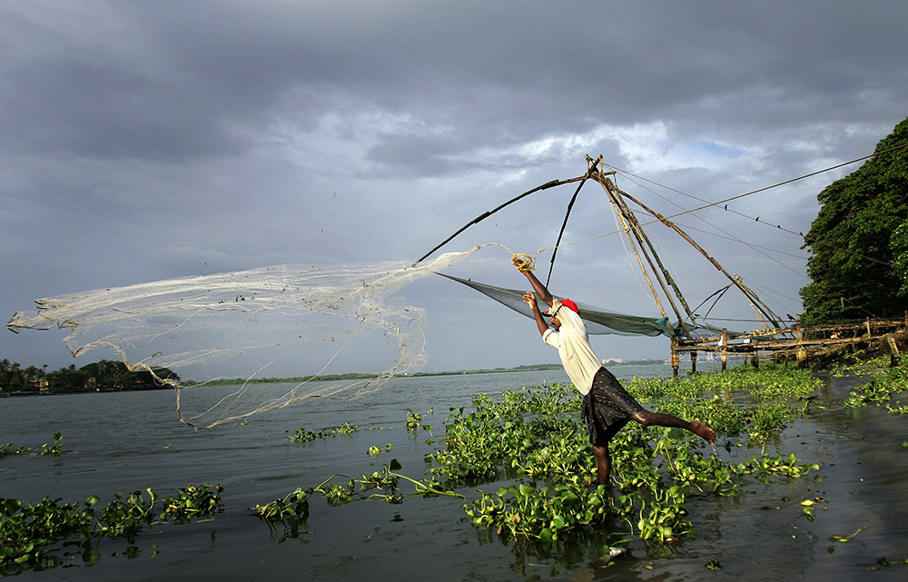 An Indian fisherman catches fish in front of the popular Chinese nets at Fort Kochi. Credit: Manan Vatsyayana/AFP An Indian fisherman catches fish in front of the popular Chinese nets at Fort Kochi. Credit: Manan Vatsyayana/AFP