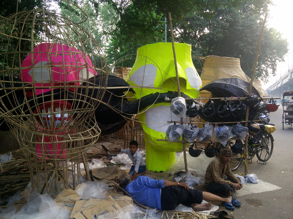 An effigy-maker catches a nap next to his wares. Photo: Rhema Mukti Baxter An effigy-maker catches a nap next to his wares. Photo: Rhema Mukti Baxter