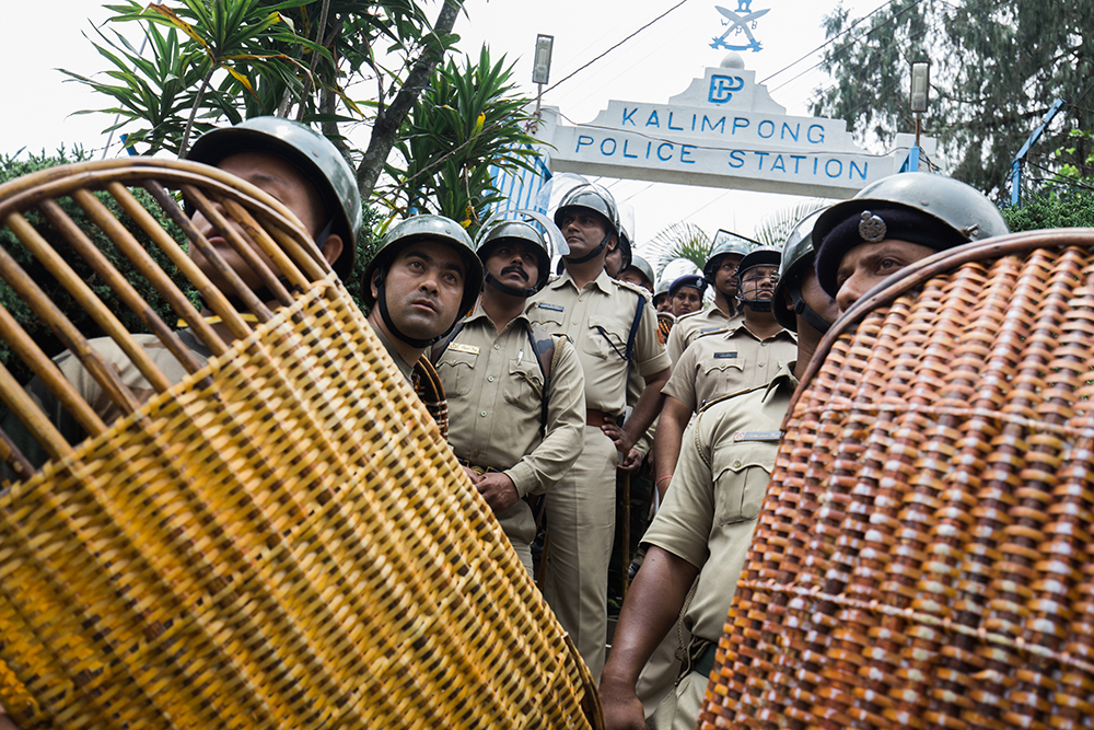 Police men stand guard during a rally in Kalimpong on June 15. Photo: Praveen Chettri Police men stand guard during a rally in Kalimpong on June 15. Photo: Praveen Chettri