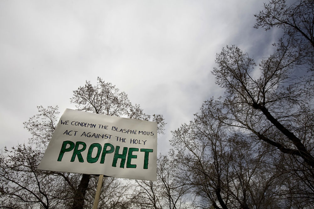 A cleric in front of the Danish embassy in Tehran holds up a placard during a protest gathering by foreign clerics living in Iran over the publication of cartoons depicting the Prophet Mohammad, March 12, 2008. Morteza Nikoubazl/Reuters A cleric in front of the Danish embassy in Tehran holds up a placard during a protest gathering by foreign clerics living in Iran over the publication of cartoons depicting the Prophet Mohammad, March 12, 2008. Morteza Nikoubazl/Reuters
