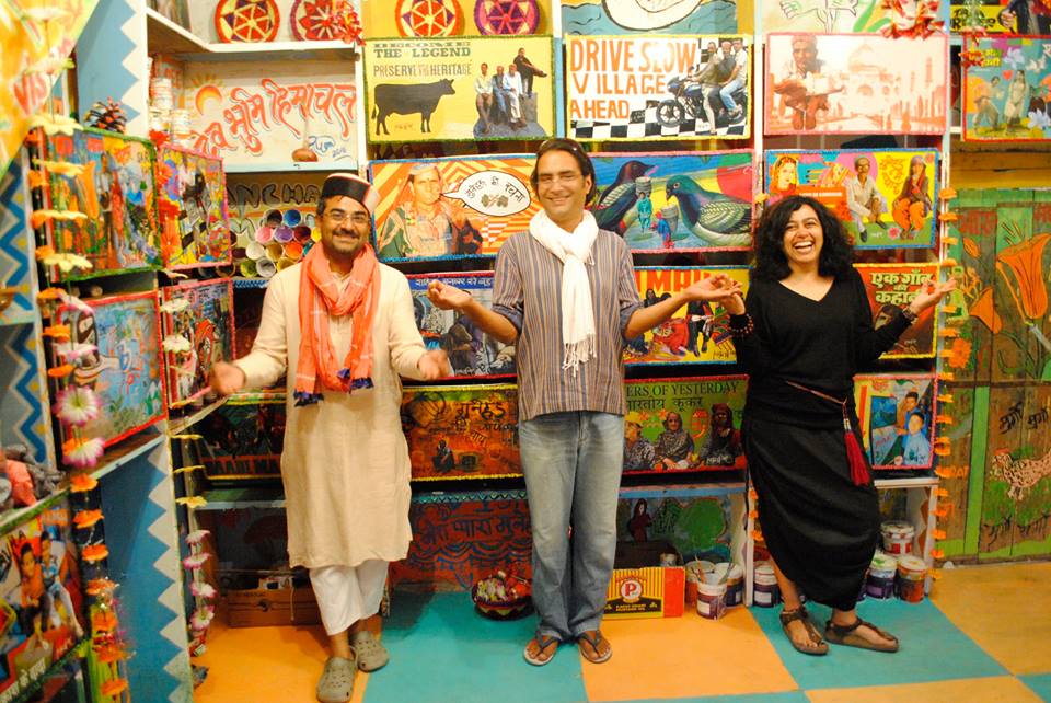 Delhi-based artist Puneet Kaushik, Gunehar's Frank Schlichtmann and British-Indian pop artist Ketna Patel – the curators of ShopArt ArtShop 2 – at Patel's Photo Ki Dukan. (Photo credit: ShopArt ArtShop/Facebook) Delhi-based artist Puneet Kaushik, Gunehar's Frank Schlichtmann and British-Indian pop artist Ketna Patel – the curators of ShopArt ArtShop 2 – at Patel's Photo Ki Dukan. (Photo credit: ShopArt ArtShop/Facebook)