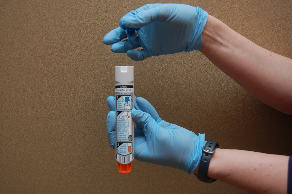 Unlike a regular pen, the EpiPen has the cap and needle tip on opposite sides. Greg Friese/ Flickr CC BY Unlike a regular pen, the EpiPen has the cap and needle tip on opposite sides. Greg Friese/ Flickr CC BY