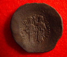 Byzantine billon trachy (a cup-shaped coin) of Andronicus 1183-1185 AD. Byzantine billon trachy (a cup-shaped coin) of Andronicus 1183-1185 AD.
