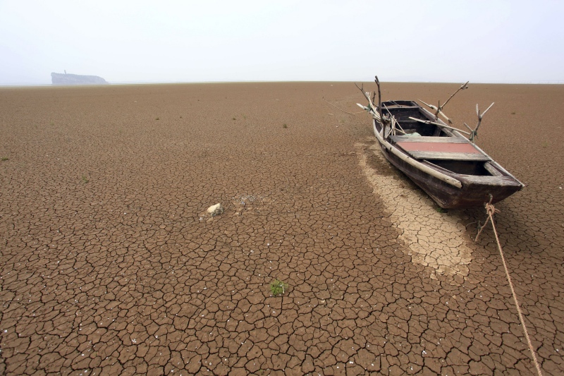 A boat is stranded on the cracked bed of a dried area of Poyang Lake in East China's Jiangxi province in 2011. (Photo credit: Reuters/China Daily). A boat is stranded on the cracked bed of a dried area of Poyang Lake in East China's Jiangxi province in 2011. (Photo credit: Reuters/China Daily).