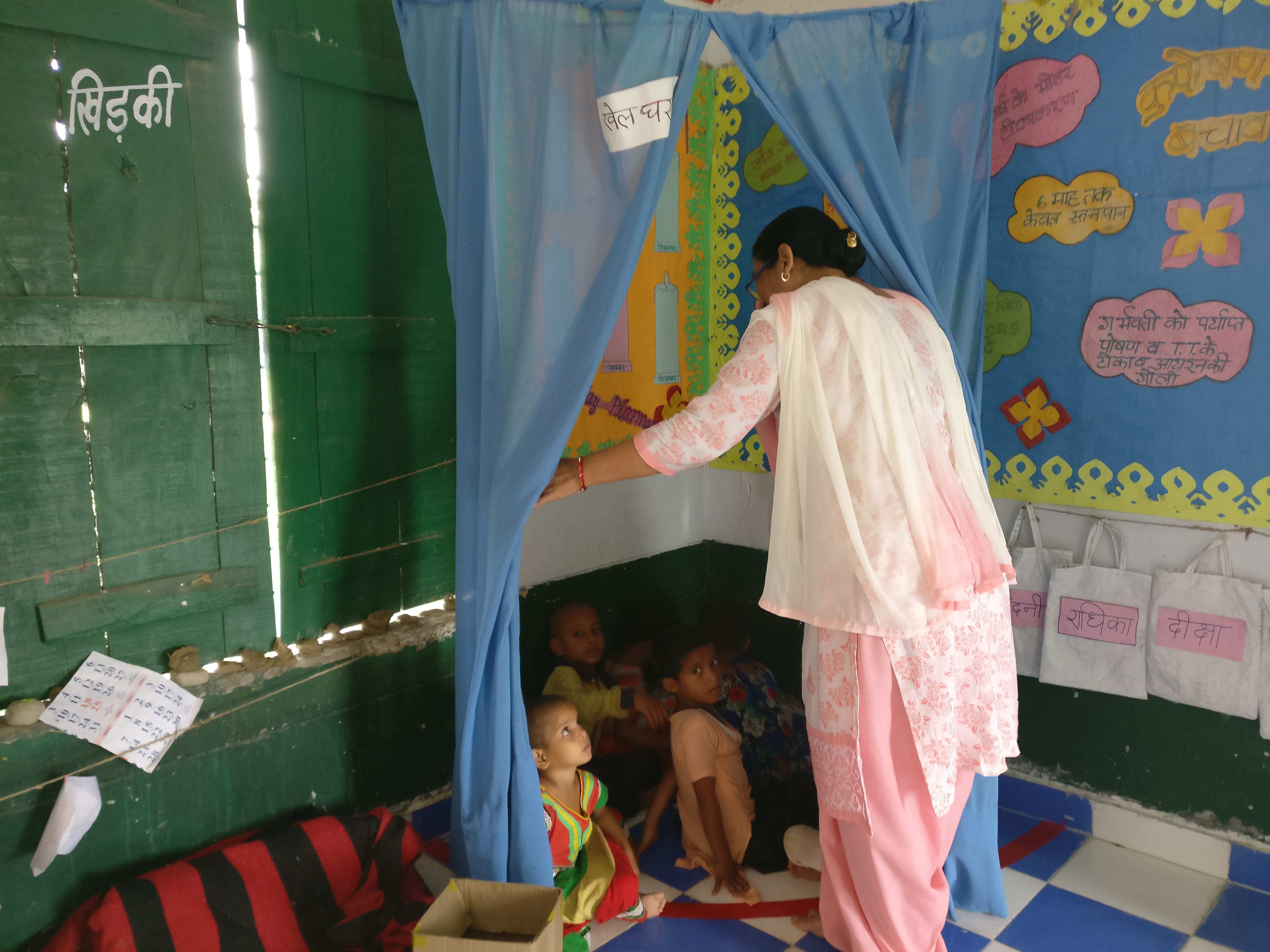 Child development project officer Komila Kaur inspects the play room fashioned out of a blue sari, the old uniform of anganwadi workers. Photo credit: Shreya Roy Chowdhury Child development project officer Komila Kaur inspects the play room fashioned out of a blue sari, the old uniform of anganwadi workers. Photo credit: Shreya Roy Chowdhury