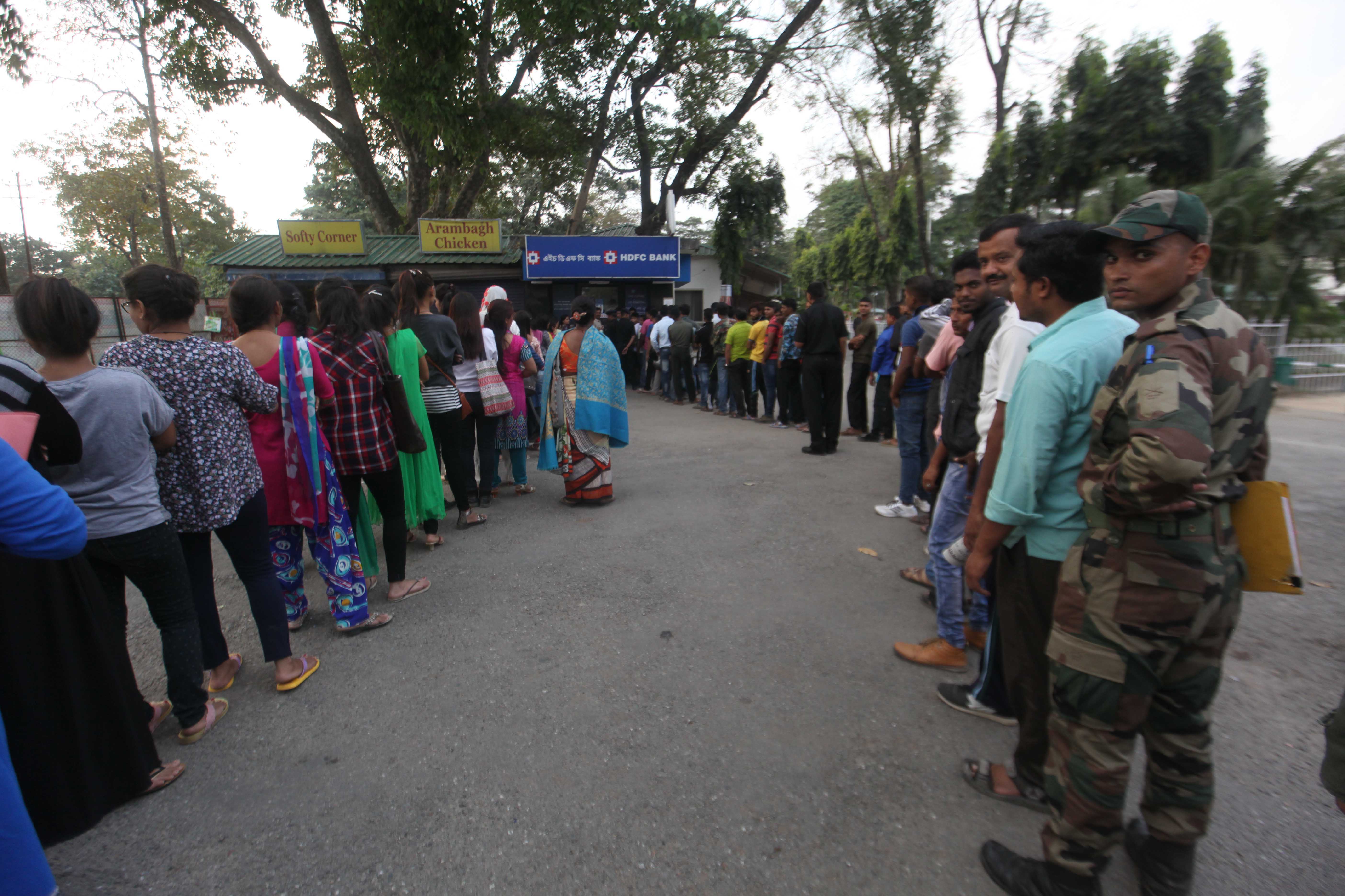 Long queues outside an ATM at the Sukna military station. Long queues outside an ATM at the Sukna military station.