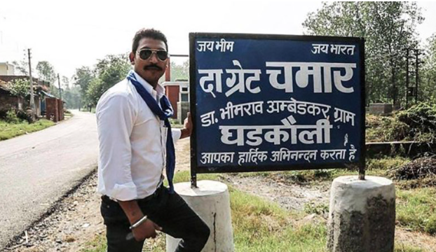 Bhim Sena leader Chandrashekhar Azad Ravan poses with the signboard in Gharkholi village. Bhim Sena leader Chandrashekhar Azad Ravan poses with the signboard in Gharkholi village.