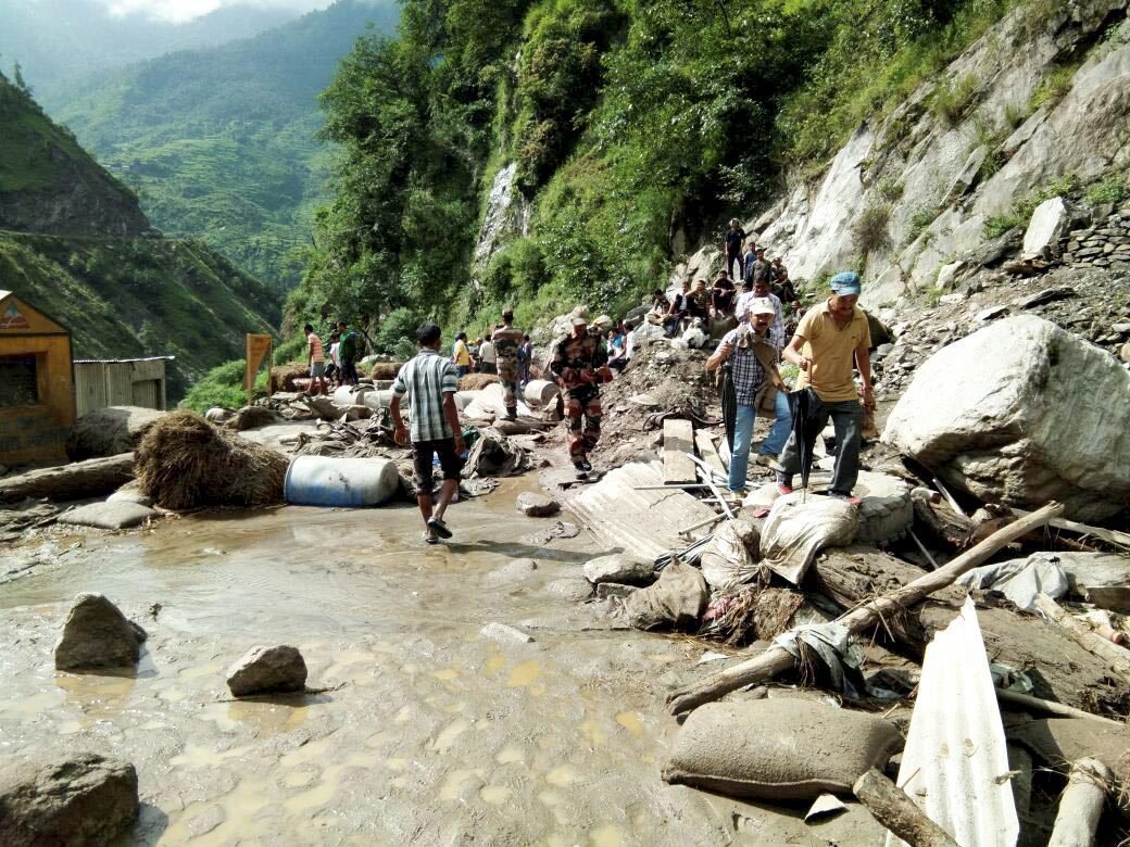 People walk along the Kailash Mansarovar route after a cloudburst in Pithoragarh distrcit in Uttarakhand. (Credit: PTI) People walk along the Kailash Mansarovar route after a cloudburst in Pithoragarh distrcit in Uttarakhand. (Credit: PTI)