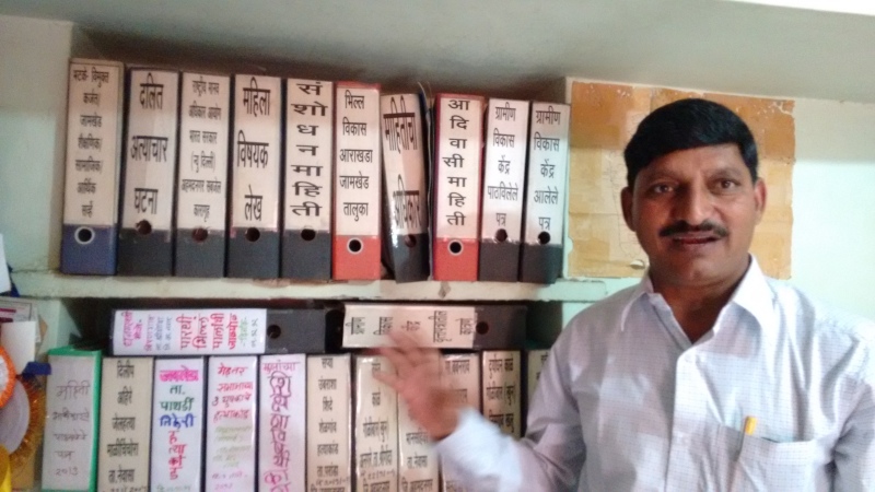 Arun Jadhav with his collection of documents related to caste crimes in three Maharashtra districts. (Photo credit: Rahi Gaikwad.) Arun Jadhav with his collection of documents related to caste crimes in three Maharashtra districts. (Photo credit: Rahi Gaikwad.)