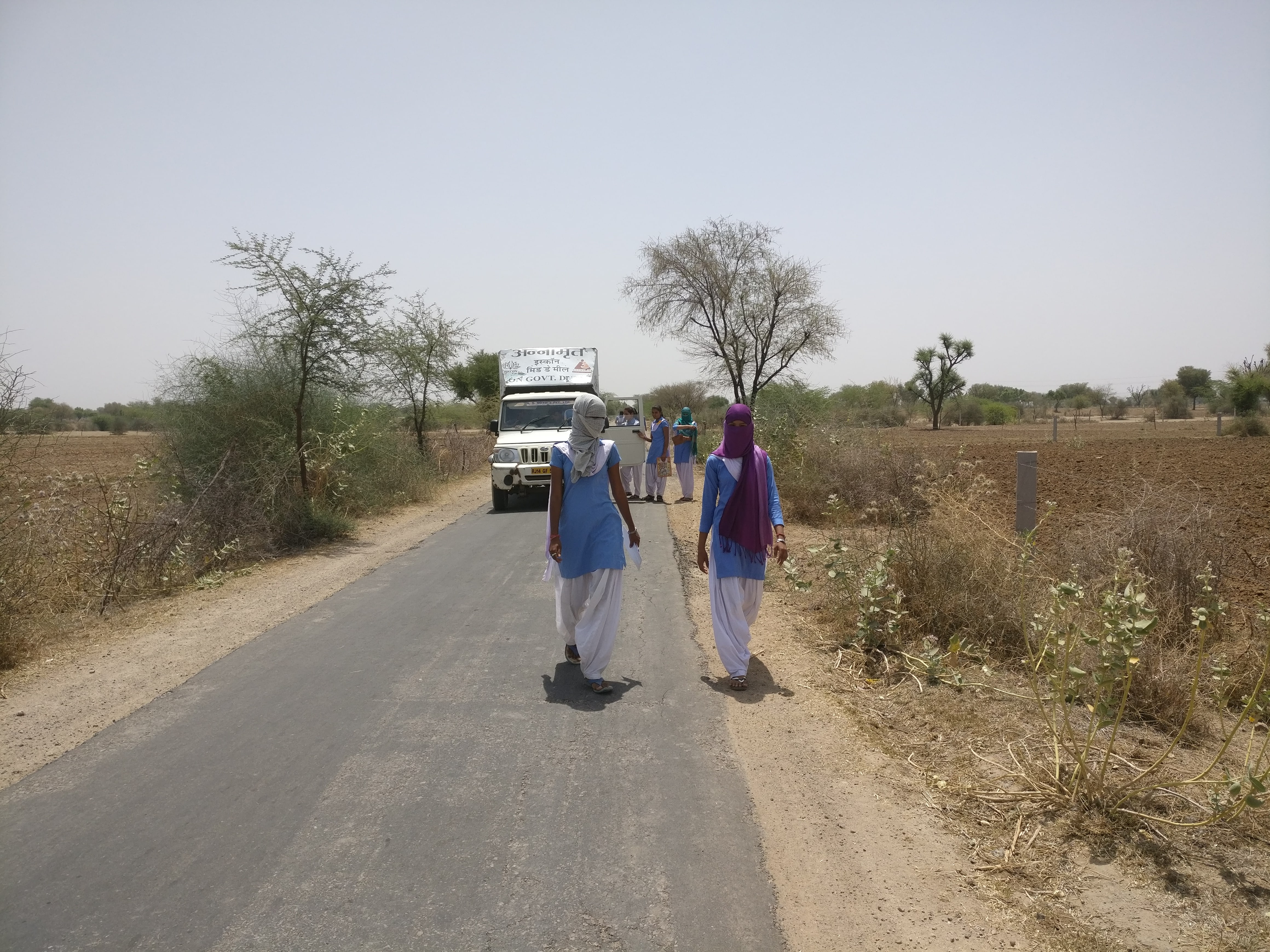 Girls walk home from the Adarsh school in Pipla after their exams. Some hitch a ride in the mid-day meal delivery van. Girls walk home from the Adarsh school in Pipla after their exams. Some hitch a ride in the mid-day meal delivery van.
