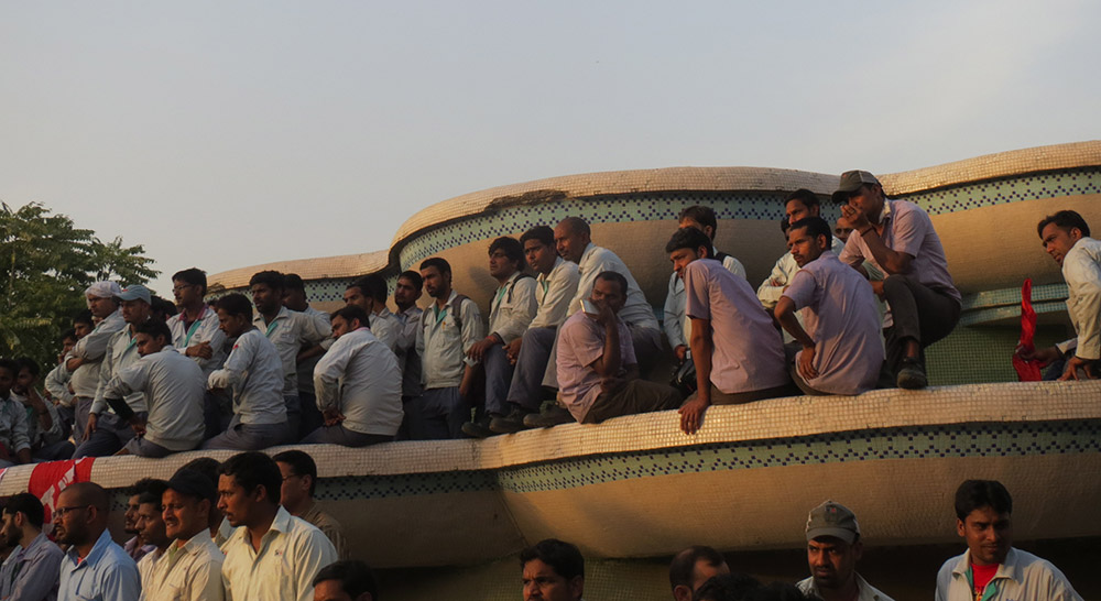 Maruti's temporary workers in their violet uniforms. They form two-thirds of the company's workforce. Maruti's temporary workers in their violet uniforms. They form two-thirds of the company's workforce.