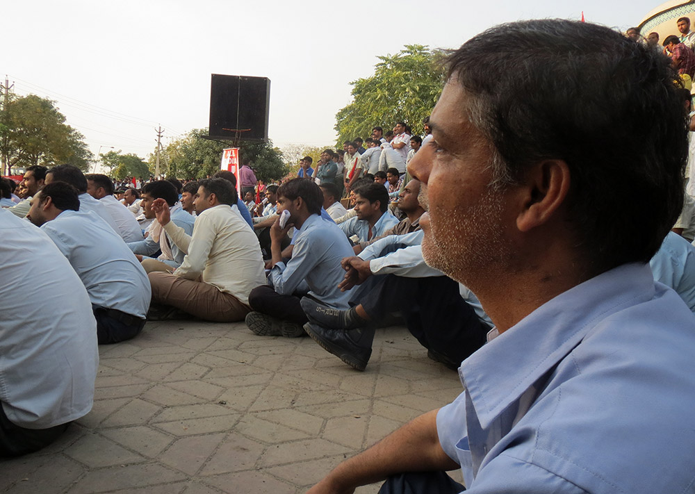 A permanent worker with STI Sanoh India Private Limited Manesar, a vendor company for Maruti Suzuki, joins the public meeting after working the morning shift. A permanent worker with STI Sanoh India Private Limited Manesar, a vendor company for Maruti Suzuki, joins the public meeting after working the morning shift.