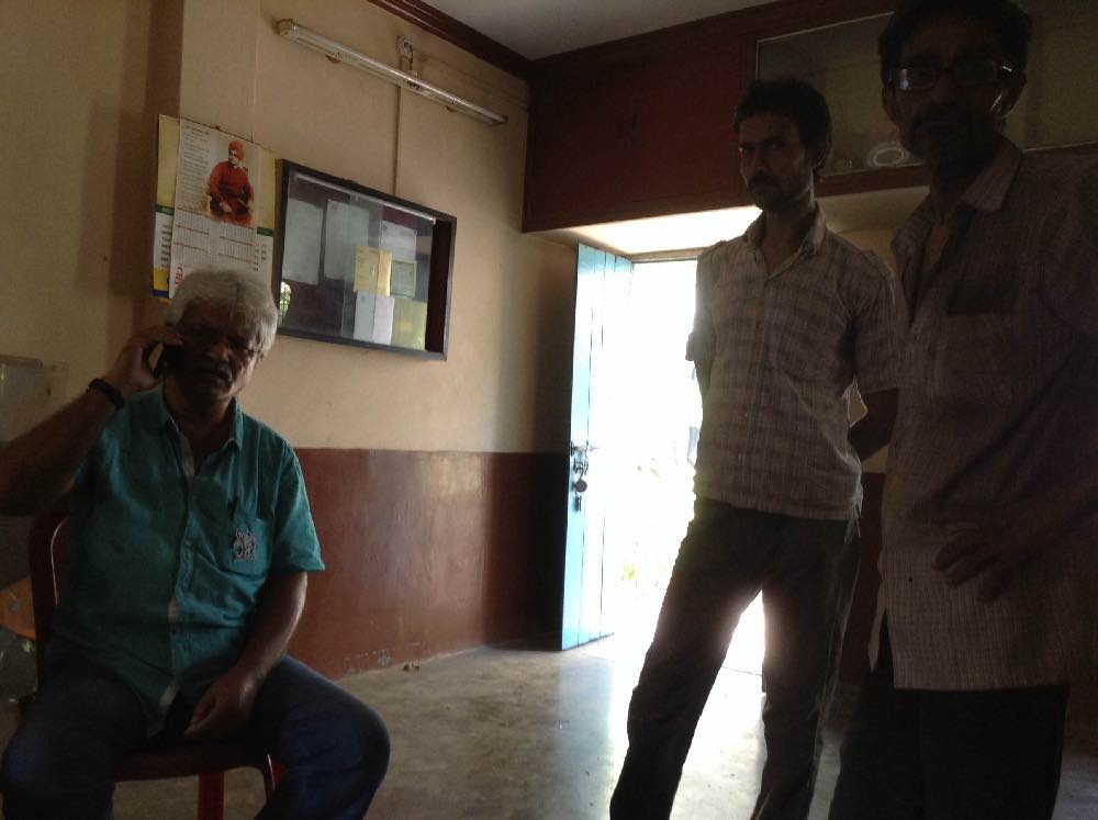 Bhaskar Dam on the phone, with party workers afoot for instructions. Photo: Sohini Chattopadhyay Bhaskar Dam on the phone, with party workers afoot for instructions. Photo: Sohini Chattopadhyay