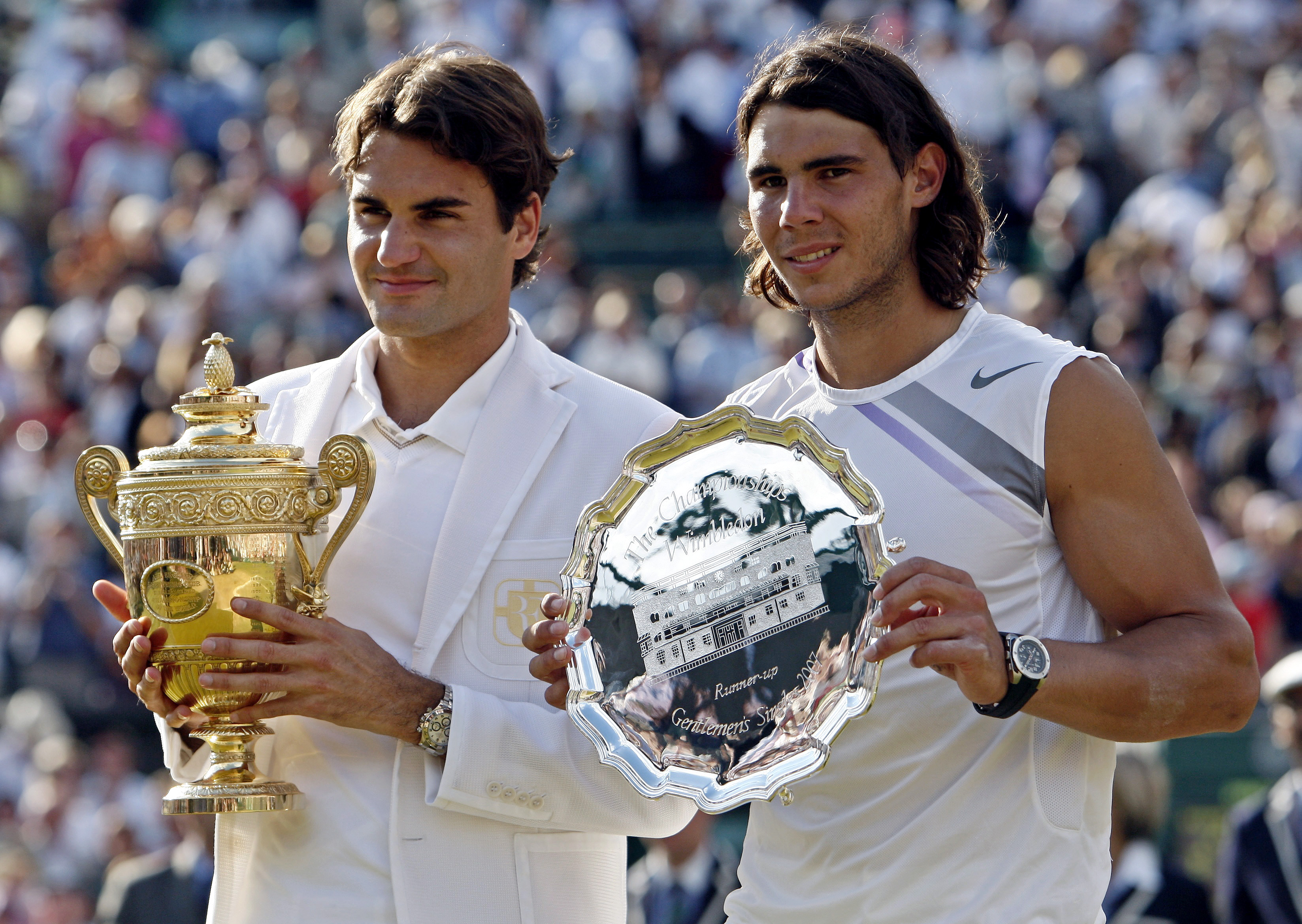 Federer (left) with Rafael Nadal in 2007 following his fourth consecutive win/Courtesy: Reuters Federer (left) with Rafael Nadal in 2007 following his fourth consecutive win/Courtesy: Reuters