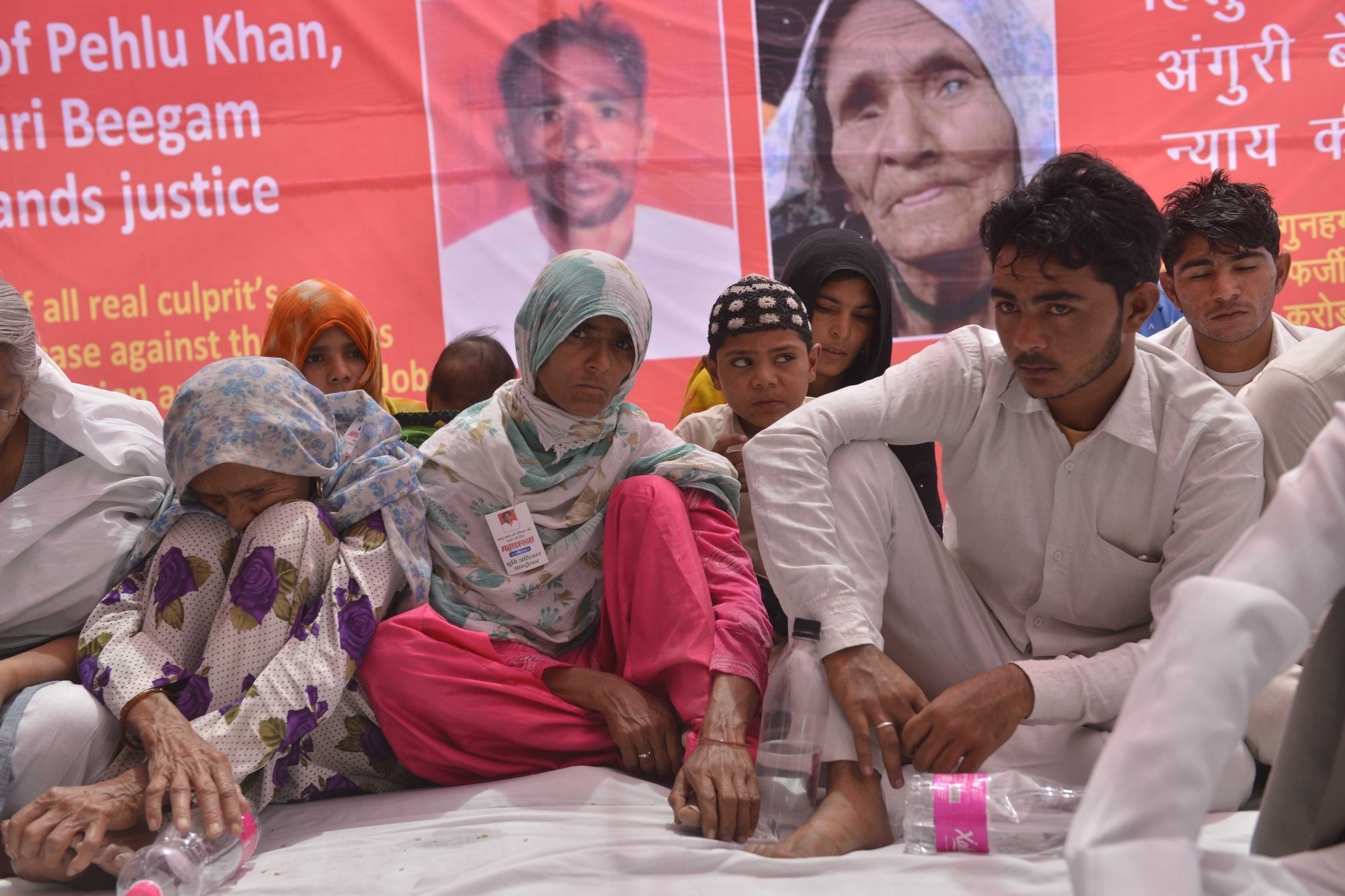 The family of dairy farmer Pehlu Khan, killed by a mob in Rajasthan in April on suspicion of smuggling cows, protests in Delhi. (Credit: IANS) The family of dairy farmer Pehlu Khan, killed by a mob in Rajasthan in April on suspicion of smuggling cows, protests in Delhi. (Credit: IANS)
