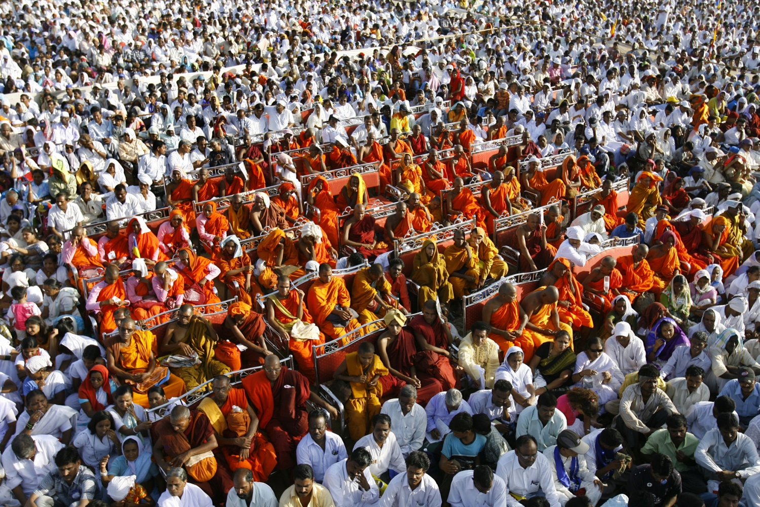 Buddhist monks, wearing saffron robes, and Dalits sit during a ceremony in which thousands of low-caste and tribal Hindus converted to Buddhism, in Mumbai. in 2007. (Photo credit: Sajjad Hussain/AFP). Buddhist monks, wearing saffron robes, and Dalits sit during a ceremony in which thousands of low-caste and tribal Hindus converted to Buddhism, in Mumbai. in 2007. (Photo credit: Sajjad Hussain/AFP).