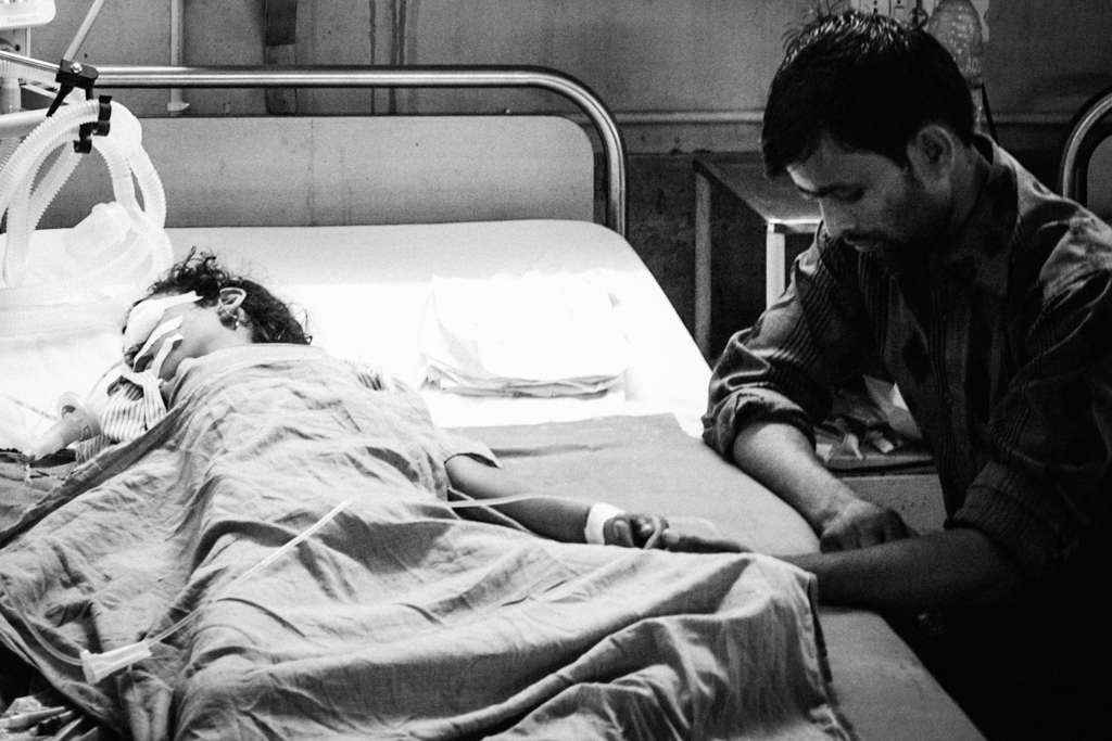 A father prays during what feels like an indefinitely long wait for his child's recovery. A father prays during what feels like an indefinitely long wait for his child's recovery.