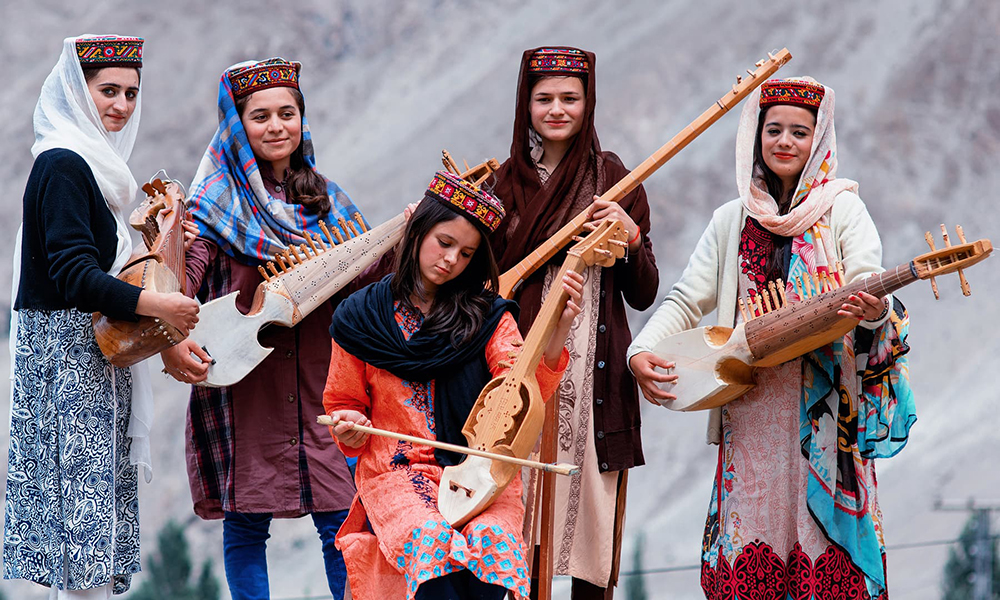 Girls play different musical instruments at the school. Girls play different musical instruments at the school.