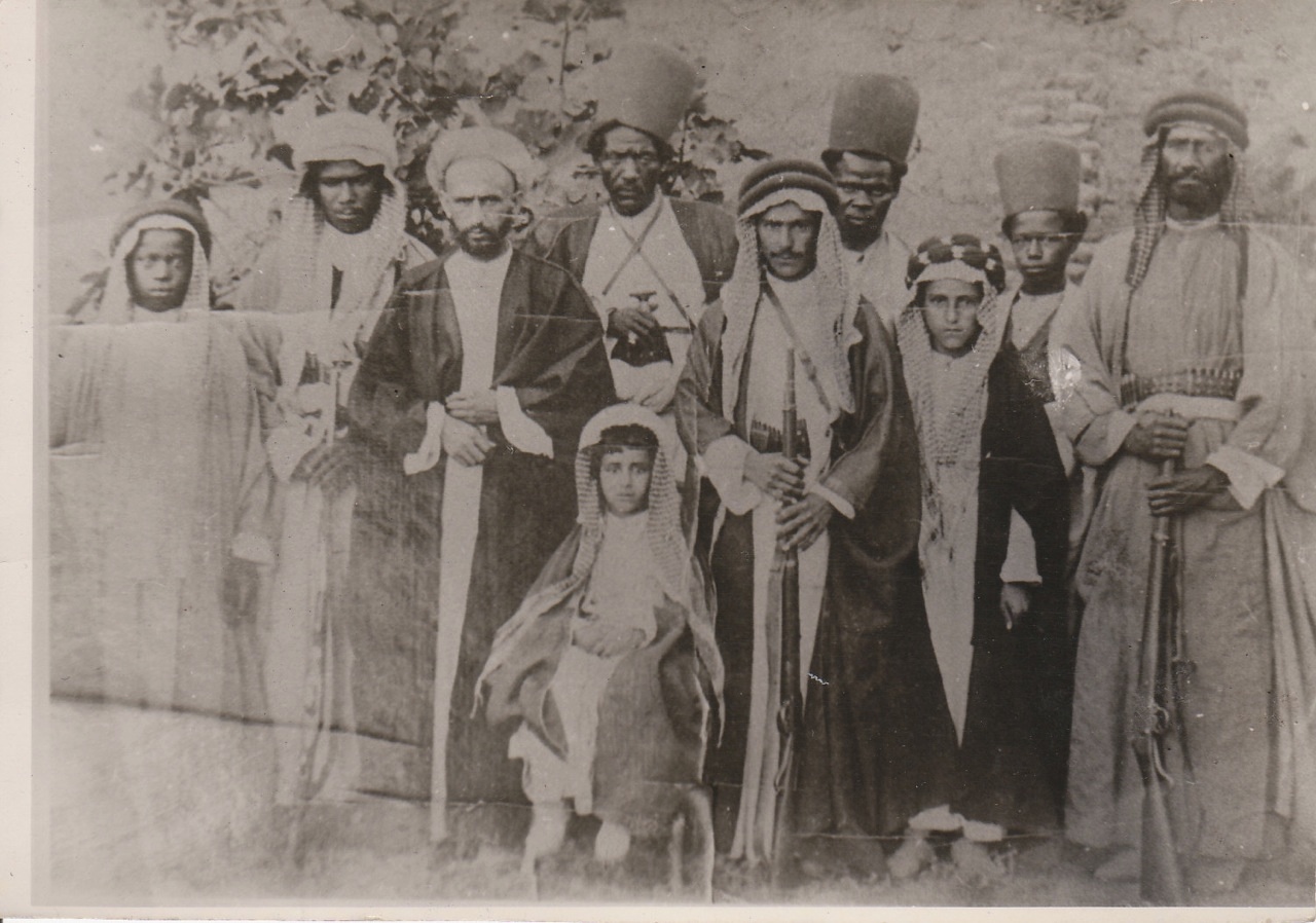 A young Sheikh Abdullah seated (centre) and his elder brother Sheikh Chassib (third from right) with a number of their retainers, 1908. Image credit: VivereInPace/Wikimedia Commons [Licensed under CC BY 4.0 A young Sheikh Abdullah seated (centre) and his elder brother Sheikh Chassib (third from right) with a number of their retainers, 1908. Image credit: VivereInPace/Wikimedia Commons [Licensed under CC BY 4.0