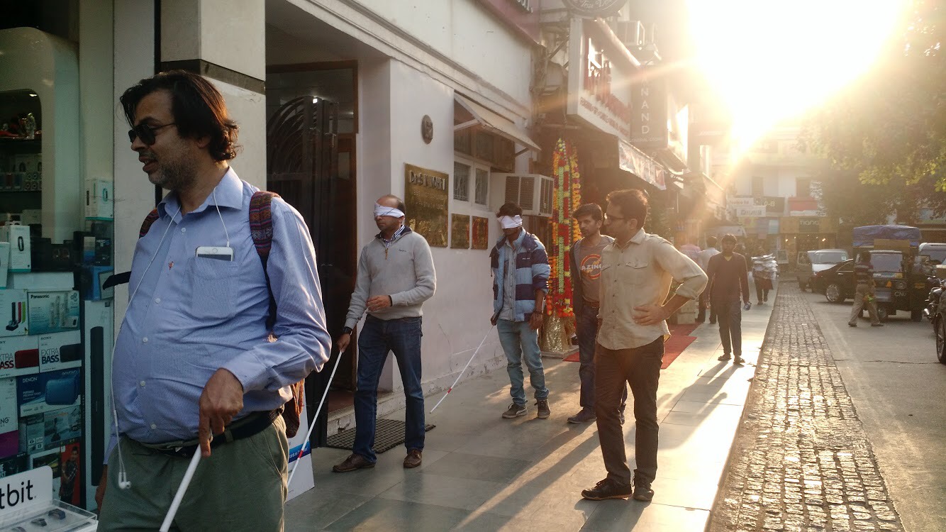 Baldev Gulati leading the Blindfolded walk in Khan Market. Baldev Gulati leading the Blindfolded walk in Khan Market.