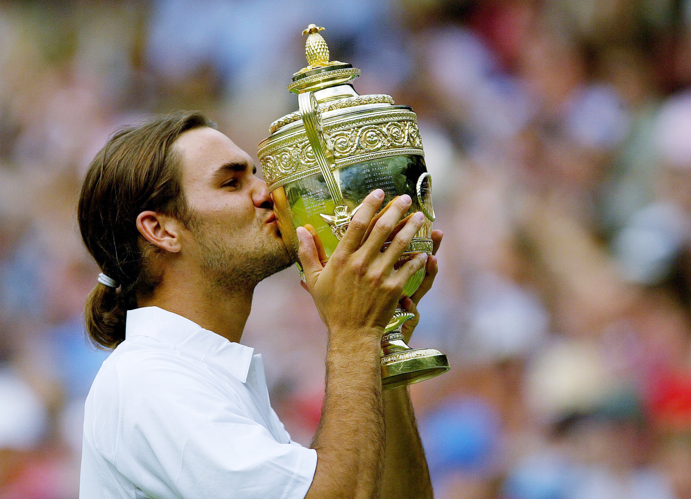 Federer after his first Wimbledon title/Courtesy: Reuters Federer after his first Wimbledon title/Courtesy: Reuters