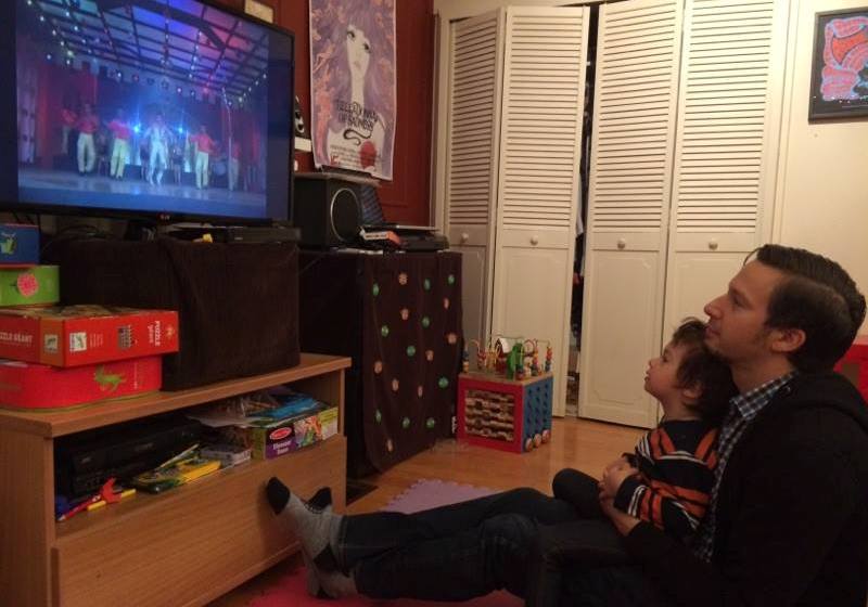 David Bertrand watches Disco Dancer with his child. David Bertrand watches Disco Dancer with his child.
