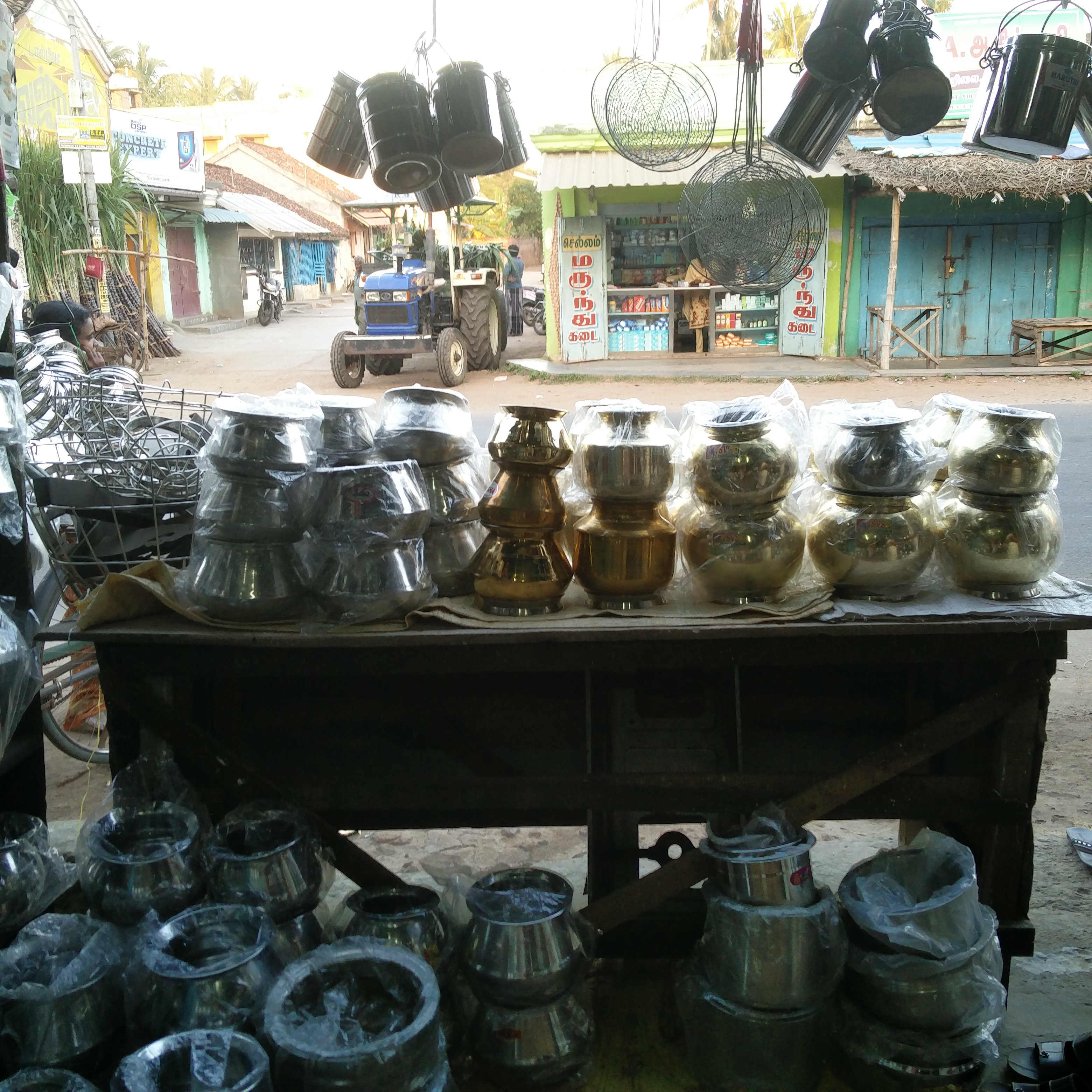 Pongal pots lie unsold at Neethirajan's shop. Pongal pots lie unsold at Neethirajan's shop.