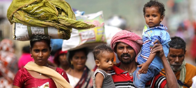 Migrant workers. (Photo credit: Reuters/Adnan Abidi). Migrant workers. (Photo credit: Reuters/Adnan Abidi).