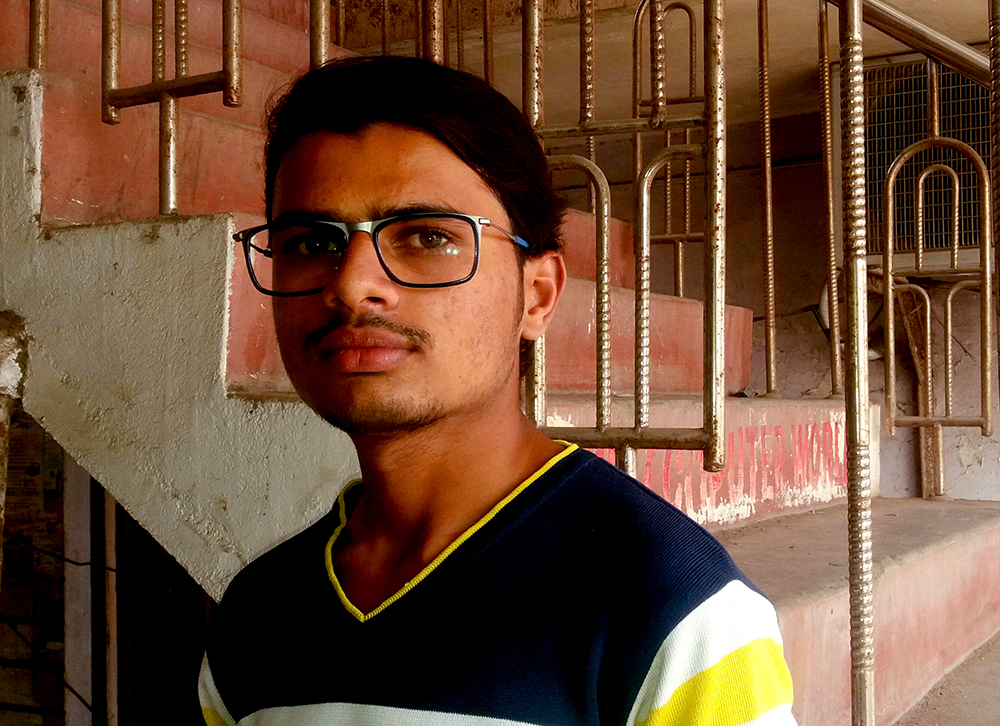 Prajesh Desai outside the eye-wear shop where he works. Prajesh Desai outside the eye-wear shop where he works.
