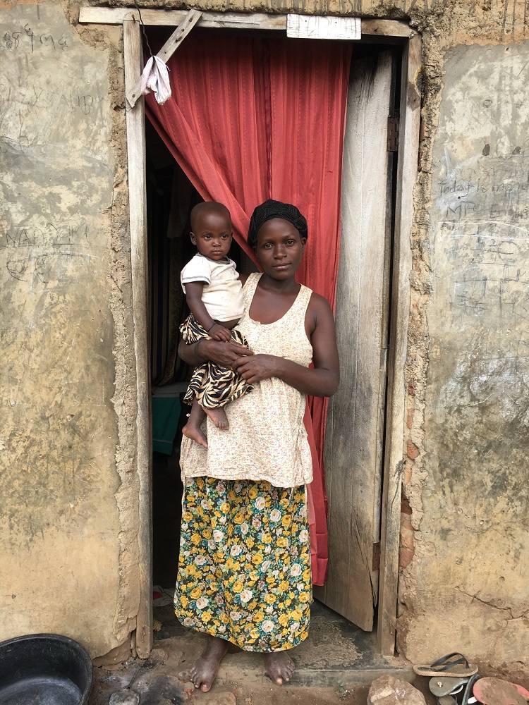 Nabirye Amina with her youngest child at her home in Iganga district of Uganda. She once delivered twins by the road side, helped by her boda boda driver. But only one child survived. Nabirye Amina with her youngest child at her home in Iganga district of Uganda. She once delivered twins by the road side, helped by her boda boda driver. But only one child survived.