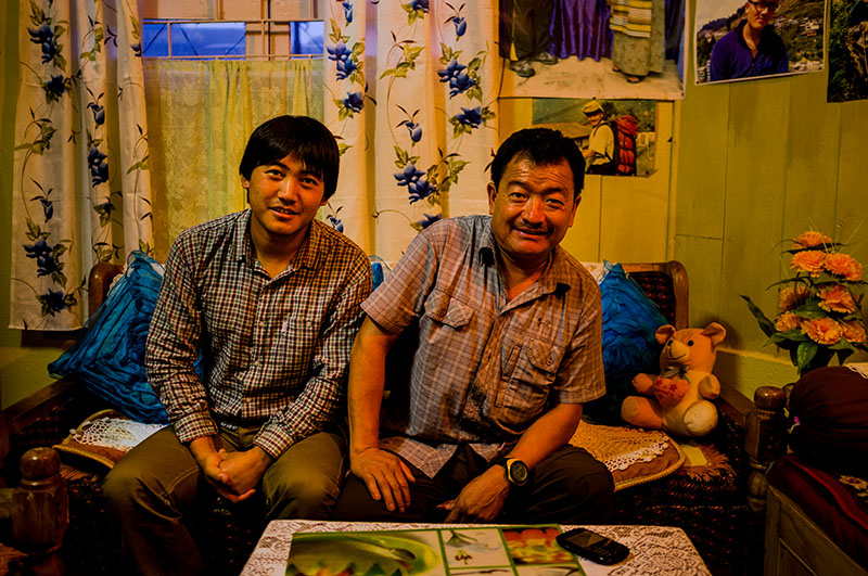 Kushang Sherpa, a trainer at the Himalayan Mountaineering Institute, holds a record for climbing Mount Everest from all five routes. Seated in his living room with his son, Kushang says he has lost several family members to mountaineering expeditions. Kushang Sherpa, a trainer at the Himalayan Mountaineering Institute, holds a record for climbing Mount Everest from all five routes. Seated in his living room with his son, Kushang says he has lost several family members to mountaineering expeditions.