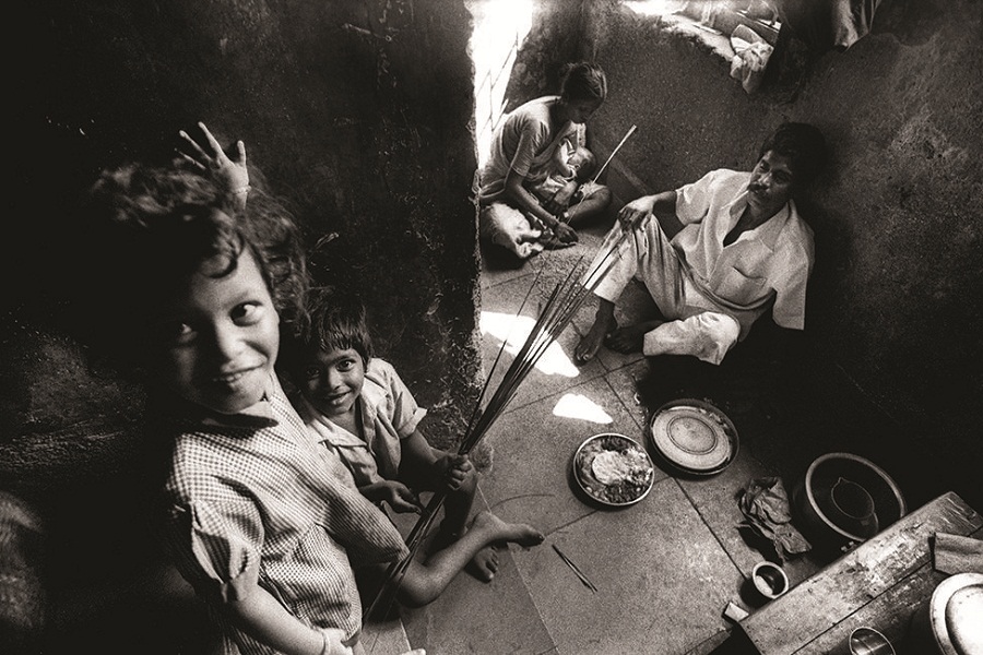 The mother of three (top right) works as a domestic servant, and lives with her family on just a portion of a staircase. The mother of three (top right) works as a domestic servant, and lives with her family on just a portion of a staircase.