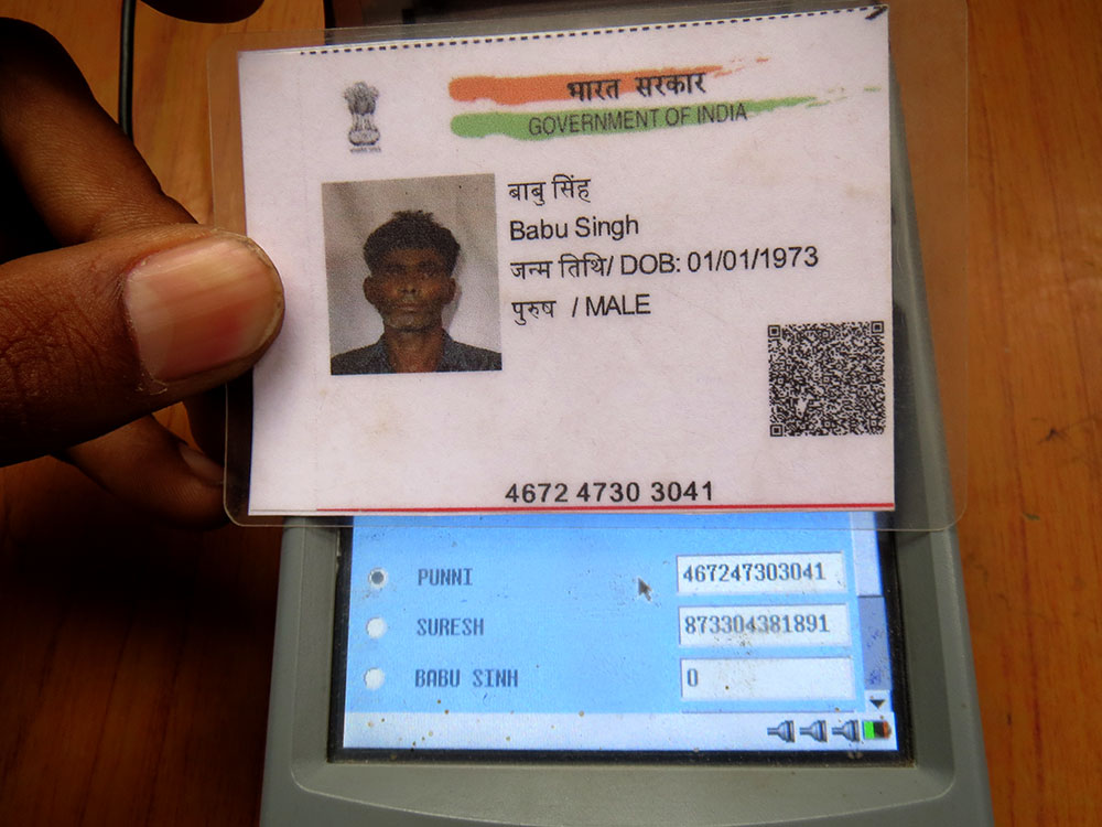 The machine reads the Aadhaar number on construction worker Babu Singh's Aadhaar card as belonging to his spouse Punni Devi. The machine reads the Aadhaar number on construction worker Babu Singh's Aadhaar card as belonging to his spouse Punni Devi.