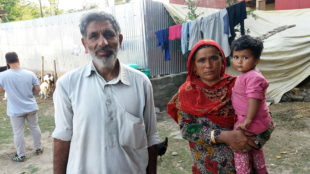 Ghulam Mohammad Khan and his wife Aisha Begum standing in their yard in Nadihal. Credit: Ipsita Chakravorty Ghulam Mohammad Khan and his wife Aisha Begum standing in their yard in Nadihal. Credit: Ipsita Chakravorty