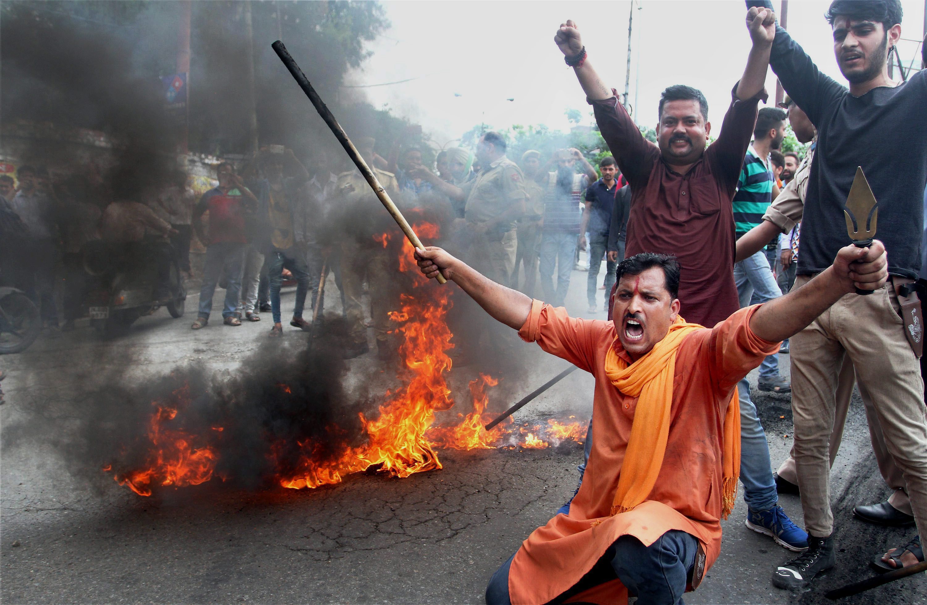 Bajrang Dal activists burn tyres and block a road in Jammu after a bandh was called in response to the Amarnath attack. (Credit: PTI) Bajrang Dal activists burn tyres and block a road in Jammu after a bandh was called in response to the Amarnath attack. (Credit: PTI)