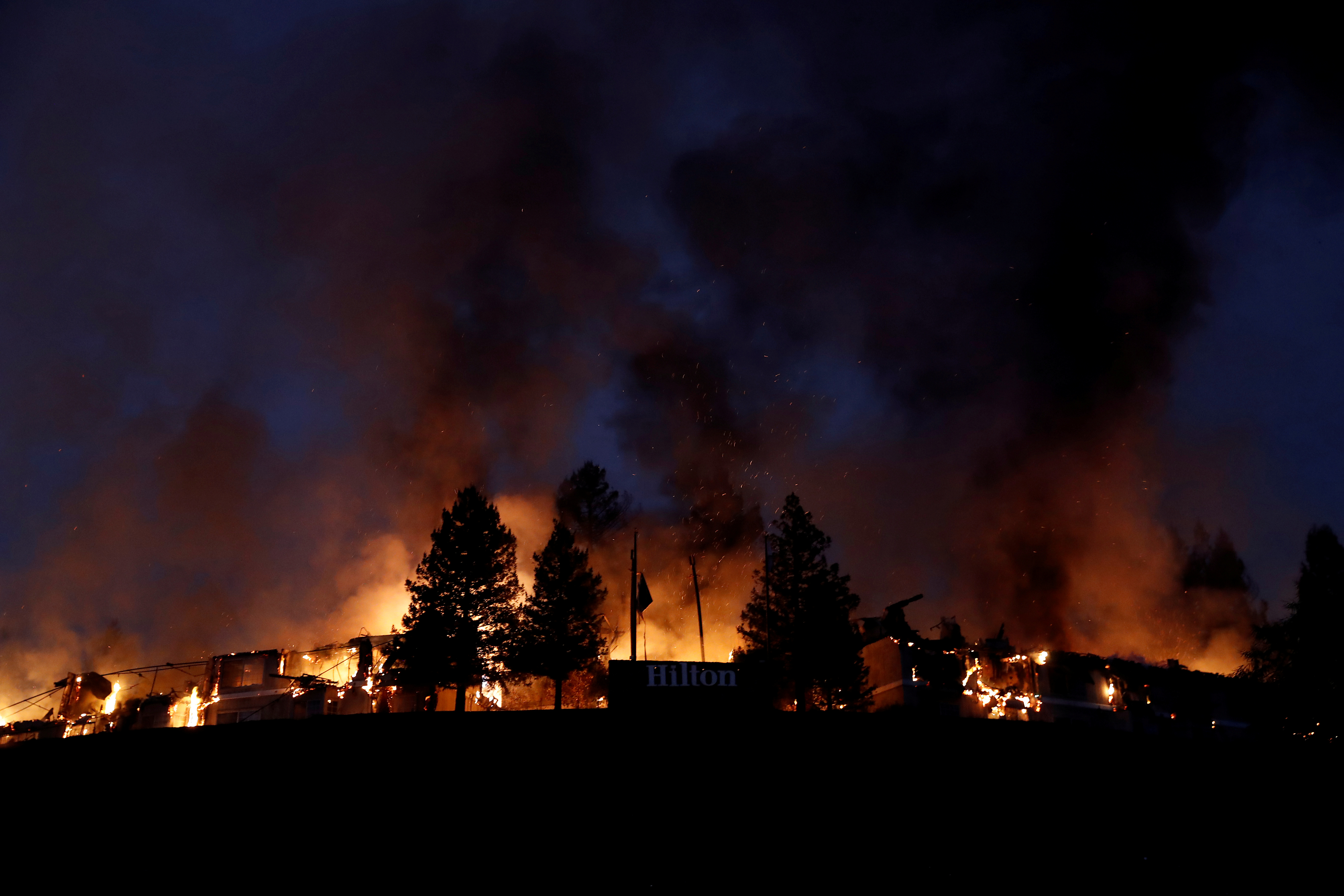 Smoke and flame rise from the Hilton Sonoma Wine Country during the Tubbs Fire in Santa Rosa. (Photo Credit: Stephen Lam/Reuters) Smoke and flame rise from the Hilton Sonoma Wine Country during the Tubbs Fire in Santa Rosa. (Photo Credit: Stephen Lam/Reuters)