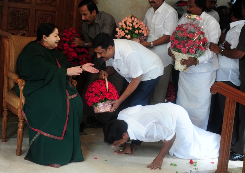 A party member prostrates himself at the feet of J Jayalalithaa at her residence in Chennai following the party’s victory in the Assembly elections in May. (Photo credit: AFP/Arun Sankar). A party member prostrates himself at the feet of J Jayalalithaa at her residence in Chennai following the party’s victory in the Assembly elections in May. (Photo credit: AFP/Arun Sankar).