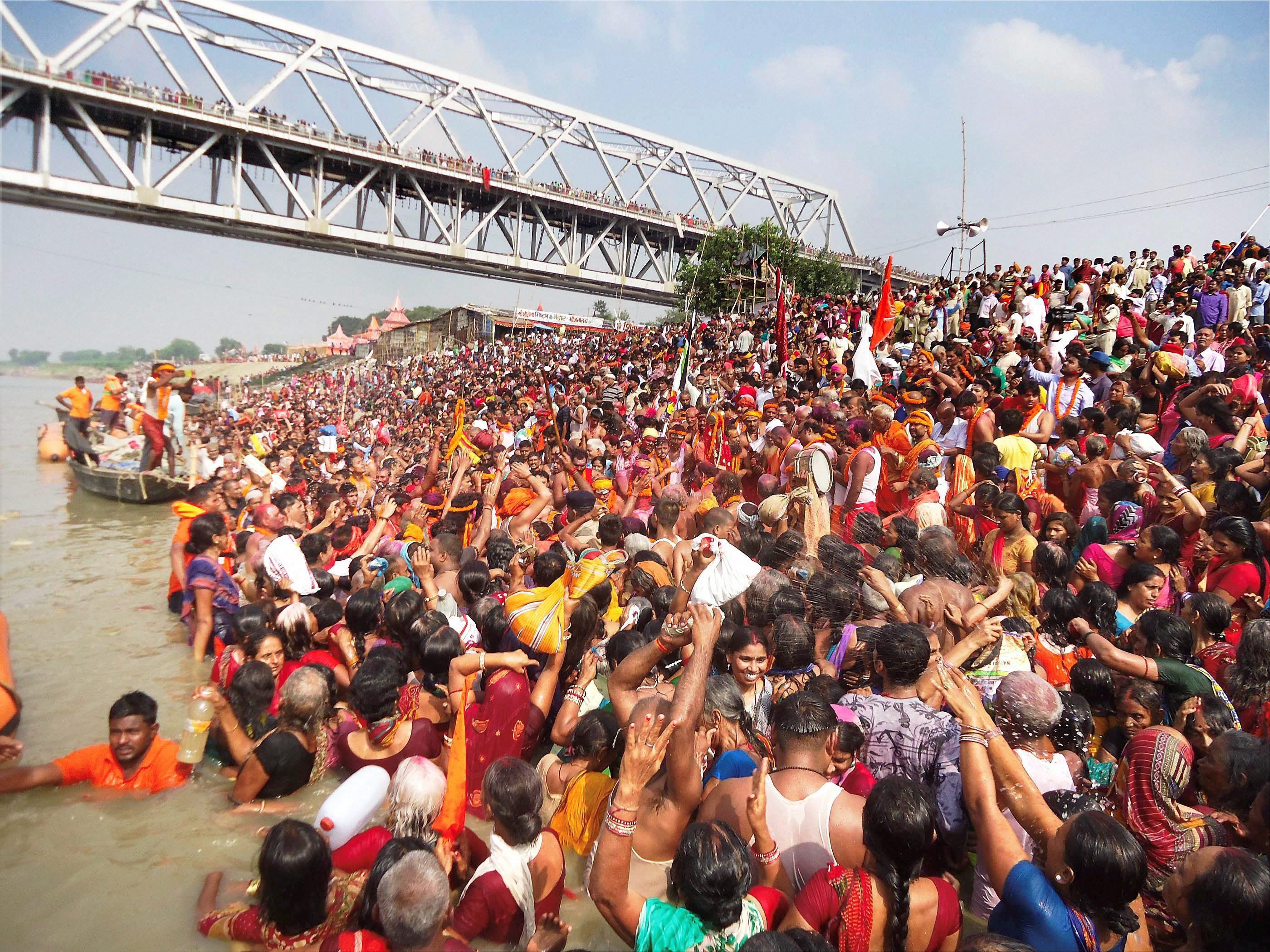 Devotees take a holy dip in the Ganga in Bihar's Simariya Ghat in Begusarai. (Credit: PTI) Devotees take a holy dip in the Ganga in Bihar's Simariya Ghat in Begusarai. (Credit: PTI)
